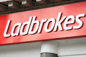 Entain sets aside £585m for possible penalties after bribery investigation