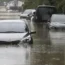Vehicles are submerged in floodwaters caused by the tropical storm in Changwon, South Korea