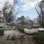 Charred vehicles near a wildfire-destroyed home in Kula, Hawaii