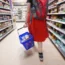 A supermarket customer with a basket of food