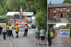 Crooked House campaigners block roads to site of fire to prevent diggers from clearing bricks away from destroyed pub