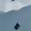 The cable car dangling hundreds of feet above the ground