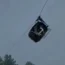 The cable car carrying dangling hundreds of feet above the ground
