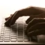 Person typing on laptop