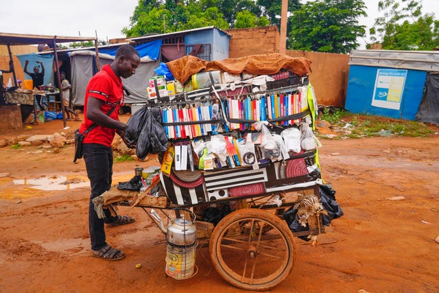 5e6194a601624250b90caa12e1ff667f A street merchant