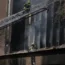 Fire marshals inspect the scene of a deadly blaze in Johannesburg