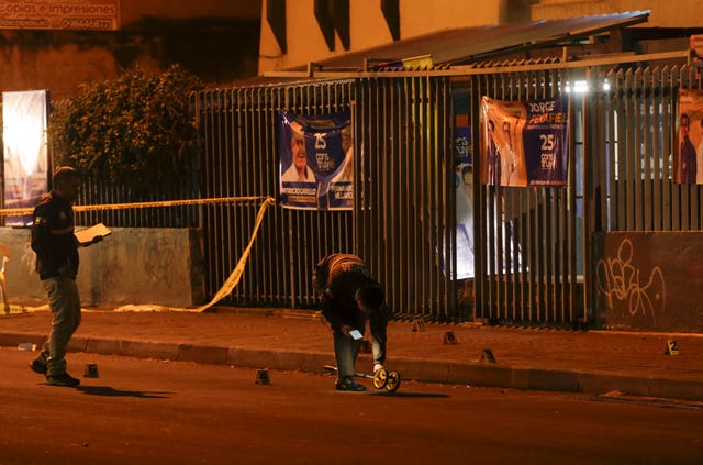a69c39a31e51413eb4c755f7e23bfeaa-2 Police investigators at the scene outside the school where the shooting took place