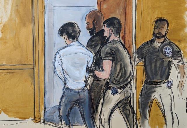 In Federal Court in New York, FTX founder Sam Bankman-Fried is escorted by court officers from the courtroom