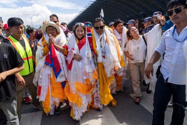 db0227b7286040898daf5eccc5f19c6d Norwegian woman mountain climber Kristin Harila, centre, and her Nepali Sherpa guide Tenjen Sherpa, left, who on Thursday set a new record by scaling the world’s 14 highest peaks in 92 days arrive at the airport in Kathmandu, Nepal