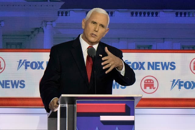 f0b2a33e48014f58b9ea7e851bb9d15a Republican presidential candidate and former vice president Mike Pence speaks during a Republican presidential primary debate in Milwaukee