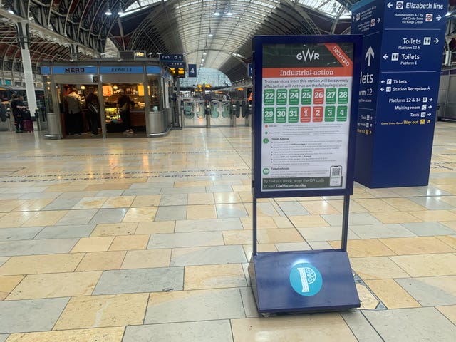 2-73539589-1 Signs at Paddington station in London warn of strike action