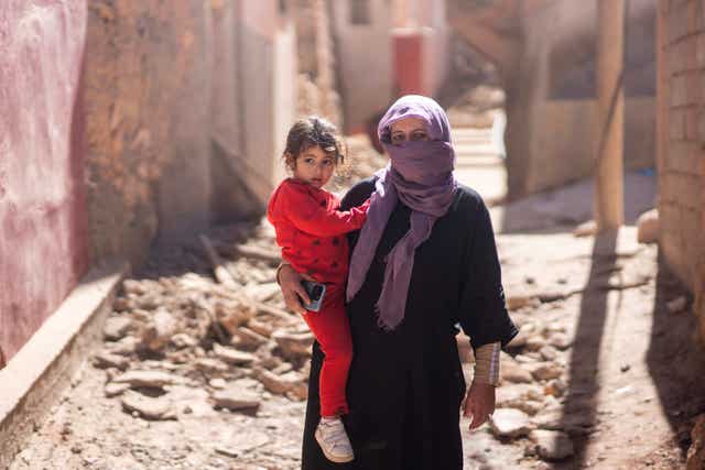 35f52c78d0e5456e8bc6272bed16a7d6 A woman and her daughter stand outside her home after the earthquake in Moulay Ibrahim village