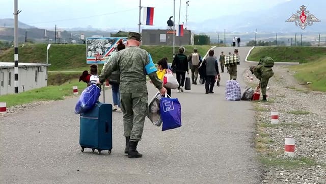 525fe5c69b1c473aae2a9135cfa5d1a2 Russian peacekeepers help ethnic Armenians to get a camp near Stepanakert in Nagorno-Karabakh