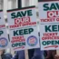 People hold placards during a protest organised by the Rail, Maritime and Transport union (RMT) opposite Downing Street, London, over the proposed closure of railway station ticket offices