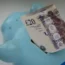A piggy bank and banknotes