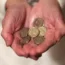 A woman holding coins