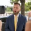 Infowars host Owen Shroyer speaks to reporters outside the E Barrett Prettyman US Federal Courthouse in Washington