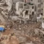 Rescuers and relatives of victims set up tents in front of collapsed buildings in Derna