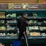 File photo of a shopper walking through the salad aisle in a supermarket