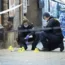 Police officers work near the scene of a shooting, in Malmo, Sweden in 2019