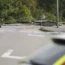 Police car with sinkhole in the background