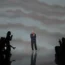 Designer Giorgio Armani accepts applause after the conclusion of his women’s spring-summer 2024 collection presented in Milan