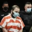 Ahmad Al Aliwi Alissa, accused of killing 10 people at a Colorado supermarket in March 2021, is led into court