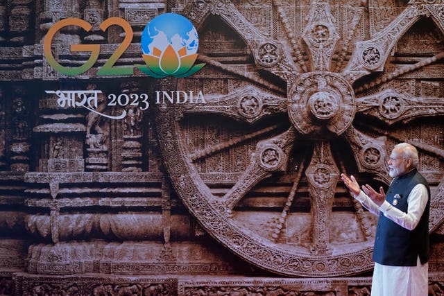Indian Prime Minister Narendra Modi gestures to welcome US President Joe Biden upon his arrival at Bharat Mandapam convention centre for the G20 summit in New Delhi, India