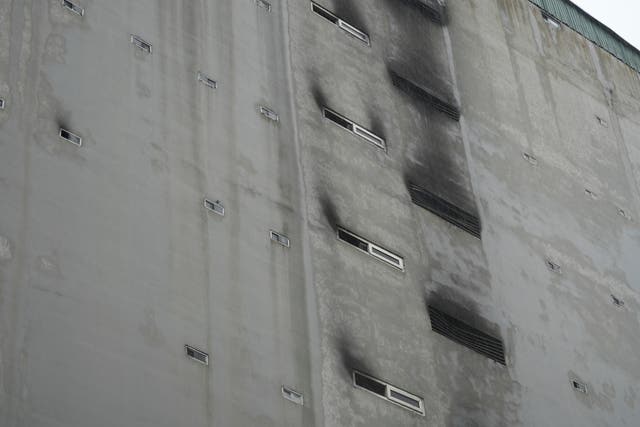 fbe09ab276024334b68f77da0445e383 Windows are seen blackened by fire and smoke after a building caught fire in Hanoi