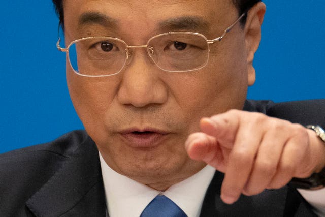 056e995fdf974206acedc0fd017f11a8 Then-Chinese premier Li Keqiang speaks during a press conference after the closing session of the National People’s Congress in Beijing’s Great Hall of the People on March 15 2019