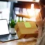 Young person packing boxes for an SME
