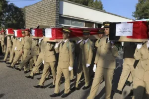 Funerals held in Syria for dozens of victims of attack on military ceremony