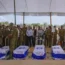 Mourners gathered around the five coffins of the Kotz family