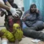 Palestinians injured in an Israeli bombardment wait for hospital treatment