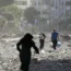 Palestinians leave wrecked homes