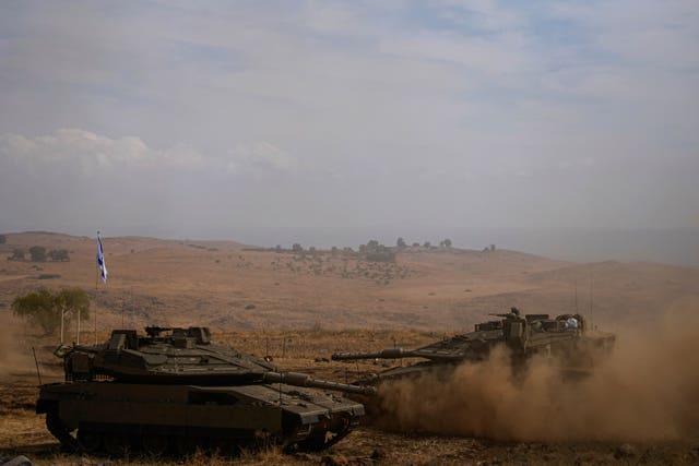 6b5091c871454fb09f94fb8446dbf6e5 Israeli tanks stationed near the border with Lebanon