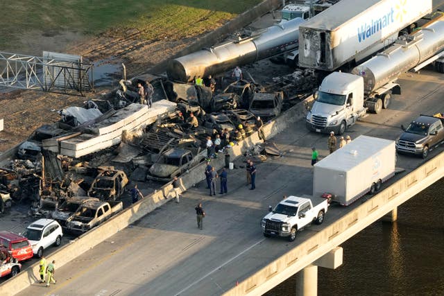 e73f150acffe40d8b7c35653e935b18a Emergency workers at the scene of the crashes