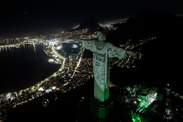 3c4e998731de42e9a9eb95844f5cd530 The Christ the Redeemer statue is illuminated with a welcome message for American singer Taylor Swift, in Rio de Janeiro, Brazil