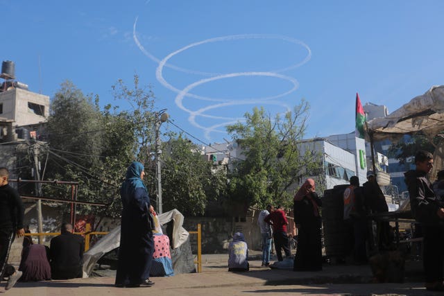 4f461fb362d44ffda51bc33d51094140 An Israeli warplane circles over Rafah on Thursday