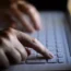 Woman’s hands using a laptop keyboard