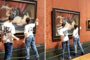 Just Stop Oil activists smash National Gallery painting famously targeted by suffragette in 1914, as two arrested