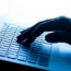 A hand on a laptop