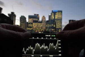 Pound slips as UK growth forecasts downgraded and oil prices plunge