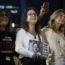 People in Tel Aviv react as they hear the news of the release of 13 Israeli hostages held by Hamas in the Gaza strip