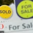 Estate agents' Sold and For Sale signs