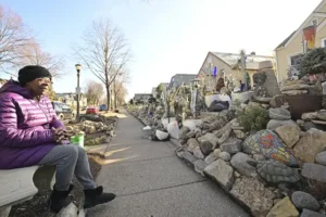 Woman’s decades-old mosaic of garden rocks and decorative artwork may have to go