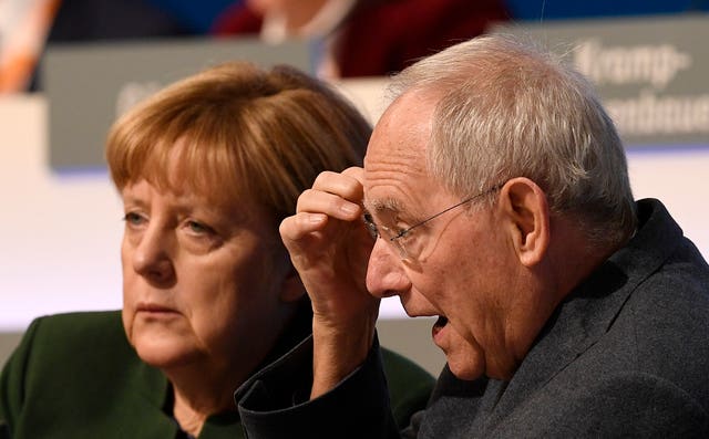164749fff1194945ba59ebe42d33635a Then-German chancellor Angela Merkel, left, and German finance minister Wolfgang Schaeuble at the general party conference of the Christian Democratic Union, CDU, in Essen, Germany, in 2016