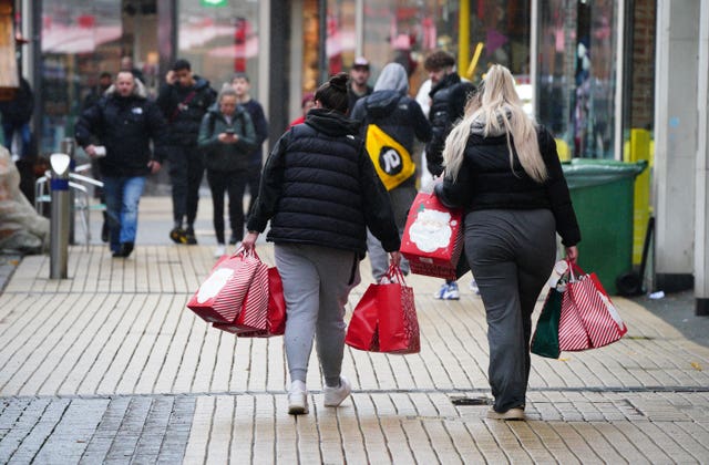 2-74945786 Shoppers in Broadmead, Bristol, ahead of Christmas Day