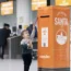 A young traveller posts a letter to Santa in one of easyJet's special post boxes