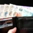 A wallet filled with cash